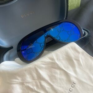 Gucci Black Frame Sunglasses with Blue Lenses
